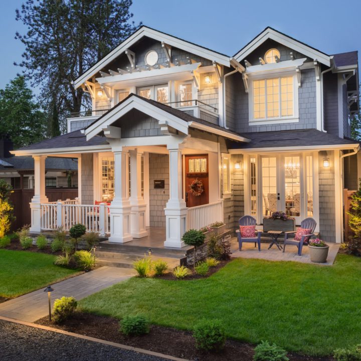 New home construction that is well lit in the evening