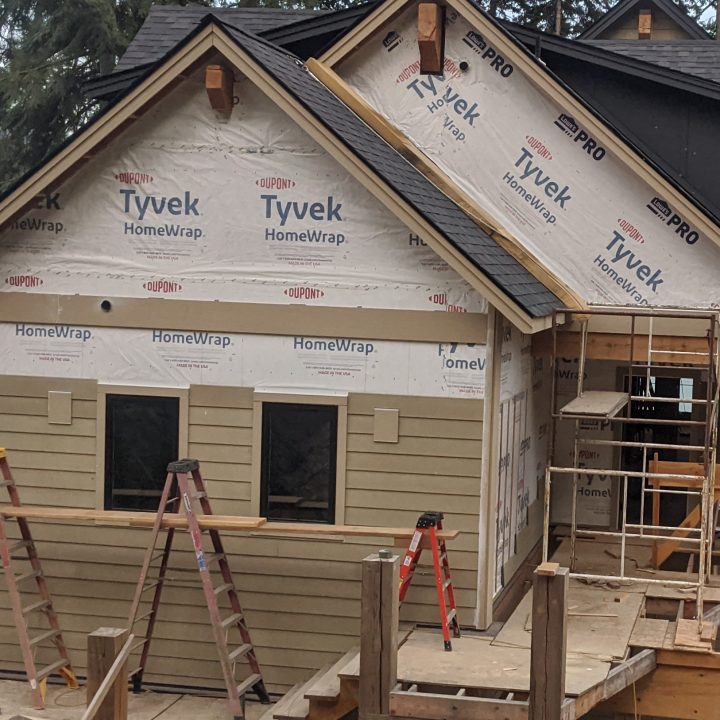 House with siding being installed - Hayden, Id